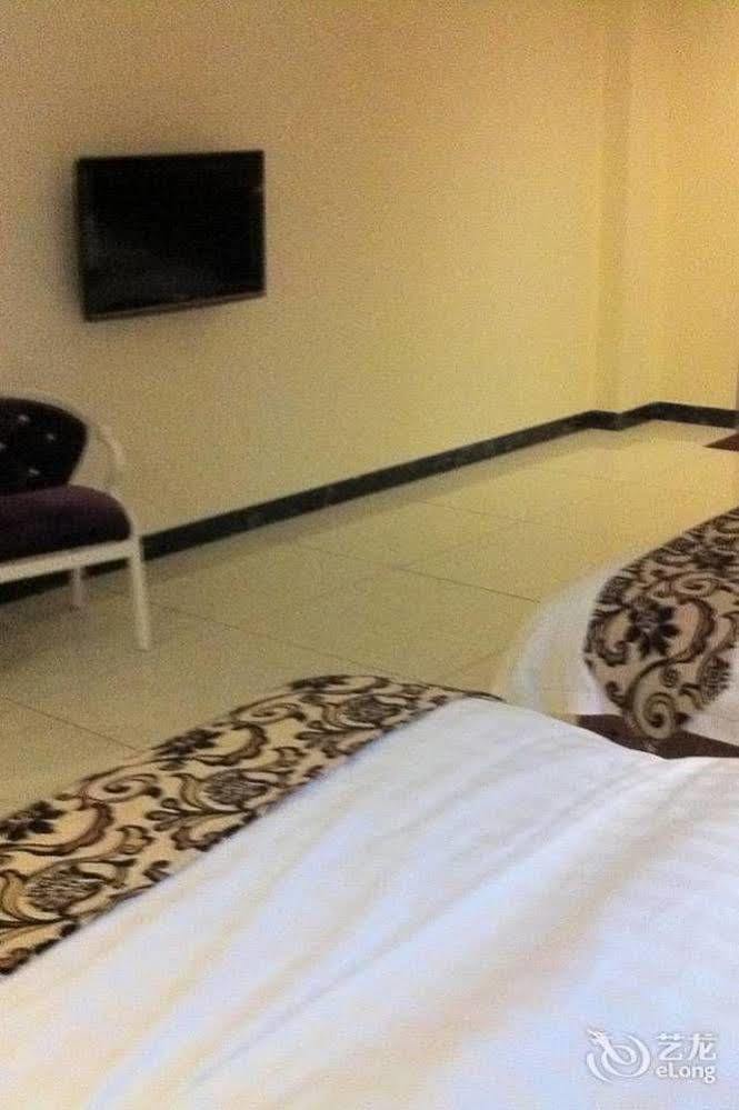 Guoxing Business Hotel Чжаоцин Экстерьер фото